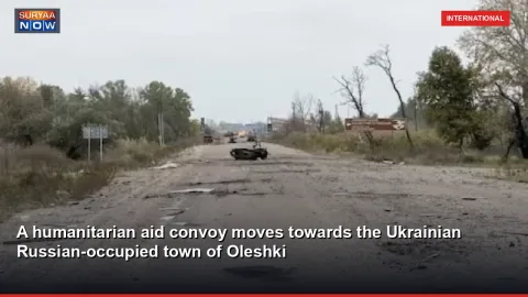 A humanitarian aid convoy moves towards the Ukrainian Russian-occupied town of Oleshki